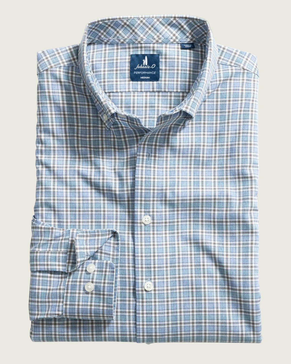 Blue plaid shirt with collar label on a white background