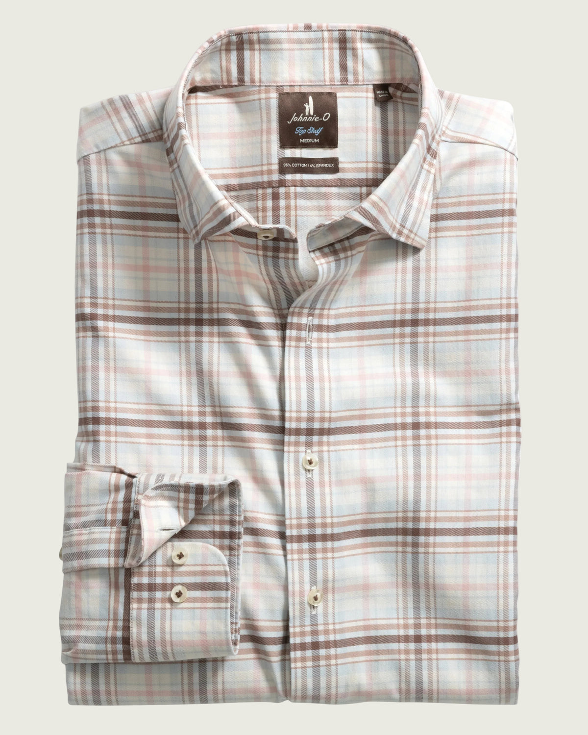 A folded long-sleeve plaid dress shirt by Anderson & Scott, featuring a light beige base with brown and muted pink plaid lines, displayed on a clean white background.