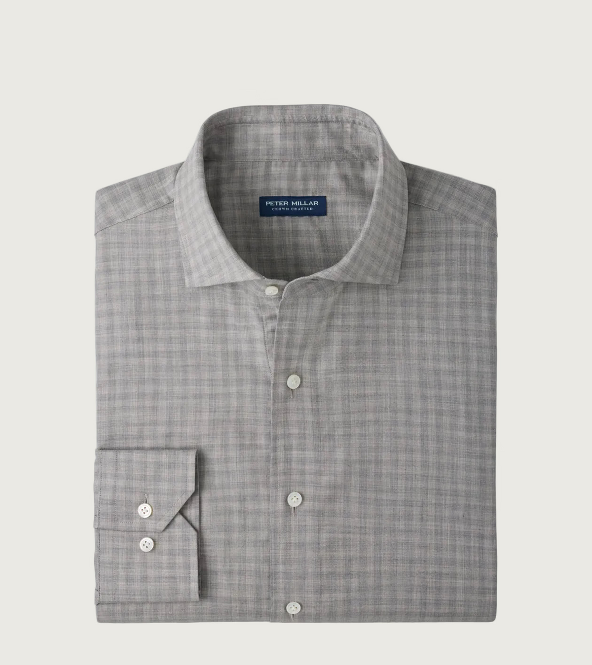 A folded Peter Millar long-sleeve dress shirt in a gray and white micro-check pattern, displayed on a clean white background.