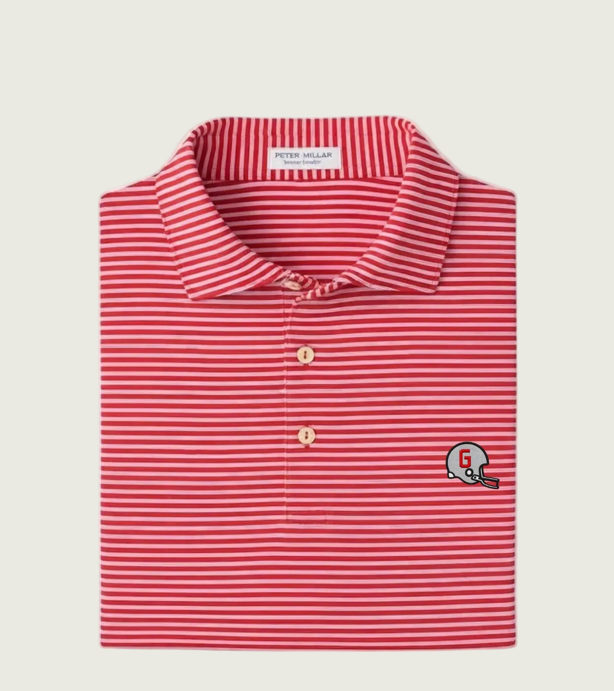A folded Peter Millar & Son polo shirt featuring red and white horizontal stripes, with a small embroidered football helmet logo on the left chest.