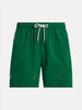 Green swim trunks with multi-colored nautical kayak embroidery motifs all over. Trunks have an elastic waistband with a white cord drawstring with metal tips at the end of each drawstring.