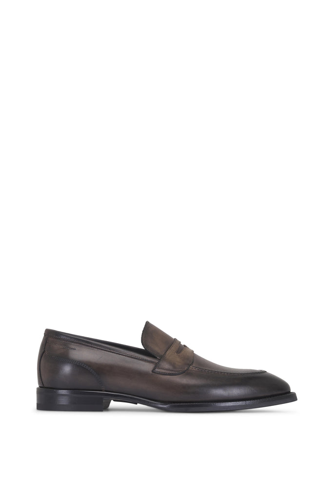 Brown leather loafer shoe on a white background