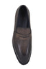 Brown leather loafer shoe on a white background