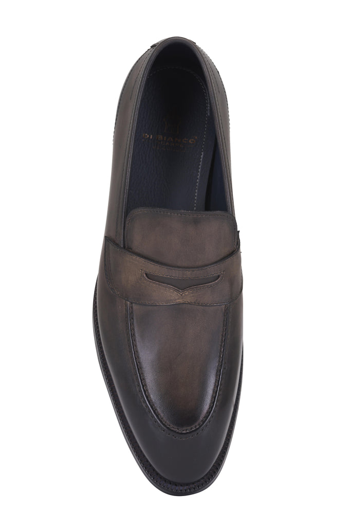 Brown leather loafer shoe on a white background