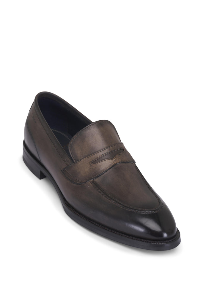 Brown leather loafer shoe on a white background