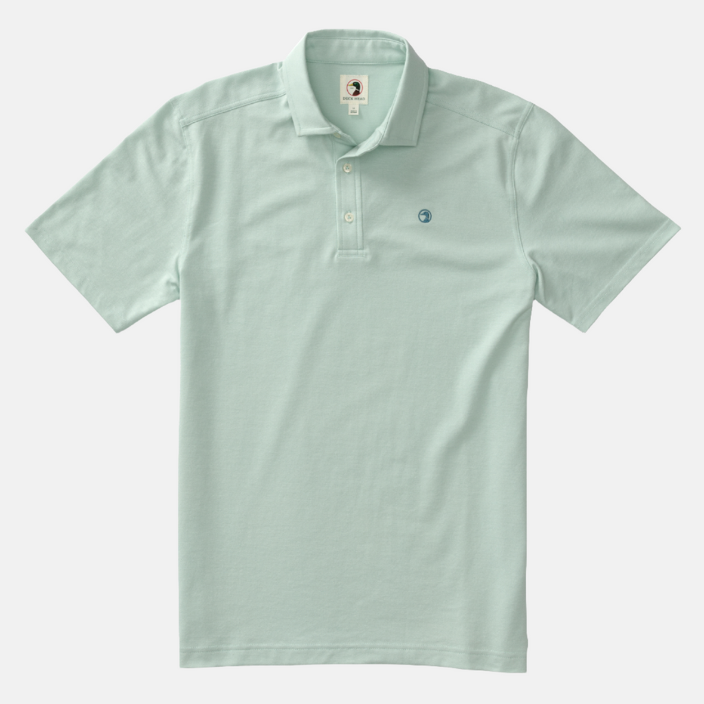 Pique polo shirt with three off white buttons in color Surf Spray, similar to a seafoam green.