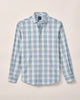 Blue and white plaid shirt on a light gray background