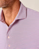 Close-up of a man wearing a pink and blue striped shirt.
