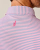 Pink and blue striped shirt with Johnnie-O logo on the nape of the neck against a neutral background