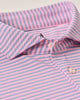 Close-up of a pink and blue striped shirt with a button detail.