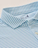 Close-up of a blue and white striped shirt with a brand logo on a light background