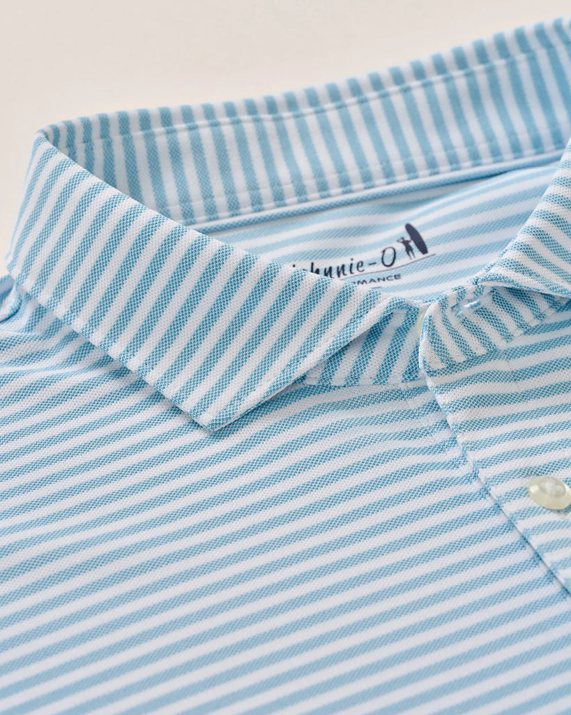 Close-up of a blue and white striped shirt with a brand logo on a light background