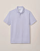 Light purple patterned polo shirt on a beige background
