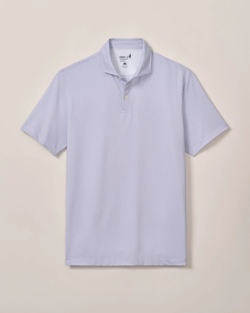 Light purple patterned polo shirt on a beige background