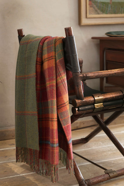 Red and Green Johnstons of Elgin blanket draped over a chair